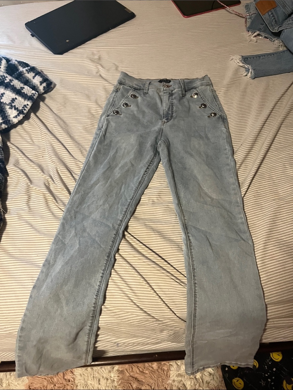 Light Blue Flared Jeans with Button Accent